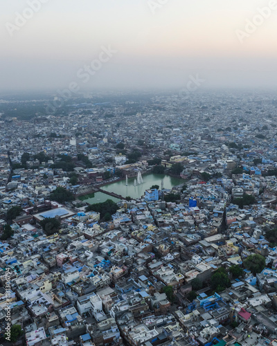 Aerial view of crowded cityscape with rooftops and buildings at dusk, Jodhpur, India.