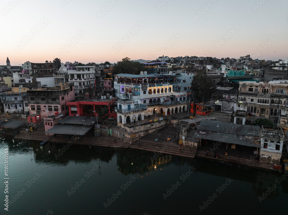 Aerial view of Pushkar Lake surrounded by colorful buildings and ghats at sunset, Pushkar, India. Aerial view of Pushkar Lake surrounded by colorful buildings and ghats at sunset, Pushkar, India.