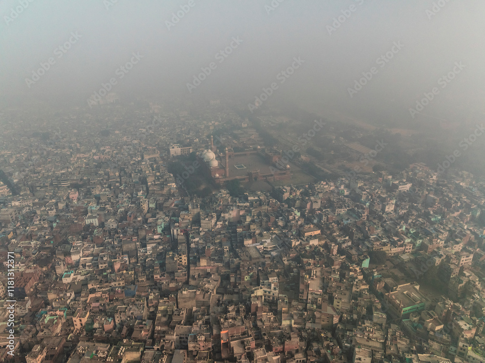 Aerial view of the bustling and vibrant cityscape featuring the historical Jama Masjid mosque, Chandni Chowk, New Delhi, India. Aerial view of the bustling and vibrant cityscape featuring the historical Jama Masjid mosque, Chandni Chowk, New Delhi, India.