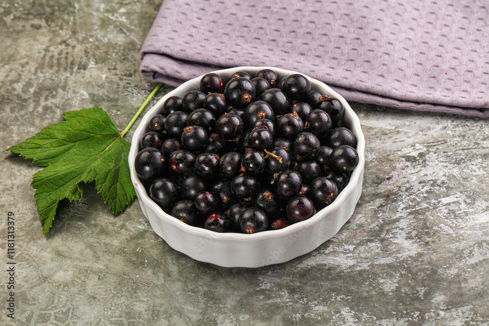 Ripe black currant in the bowl Ripe black currant in the bowl