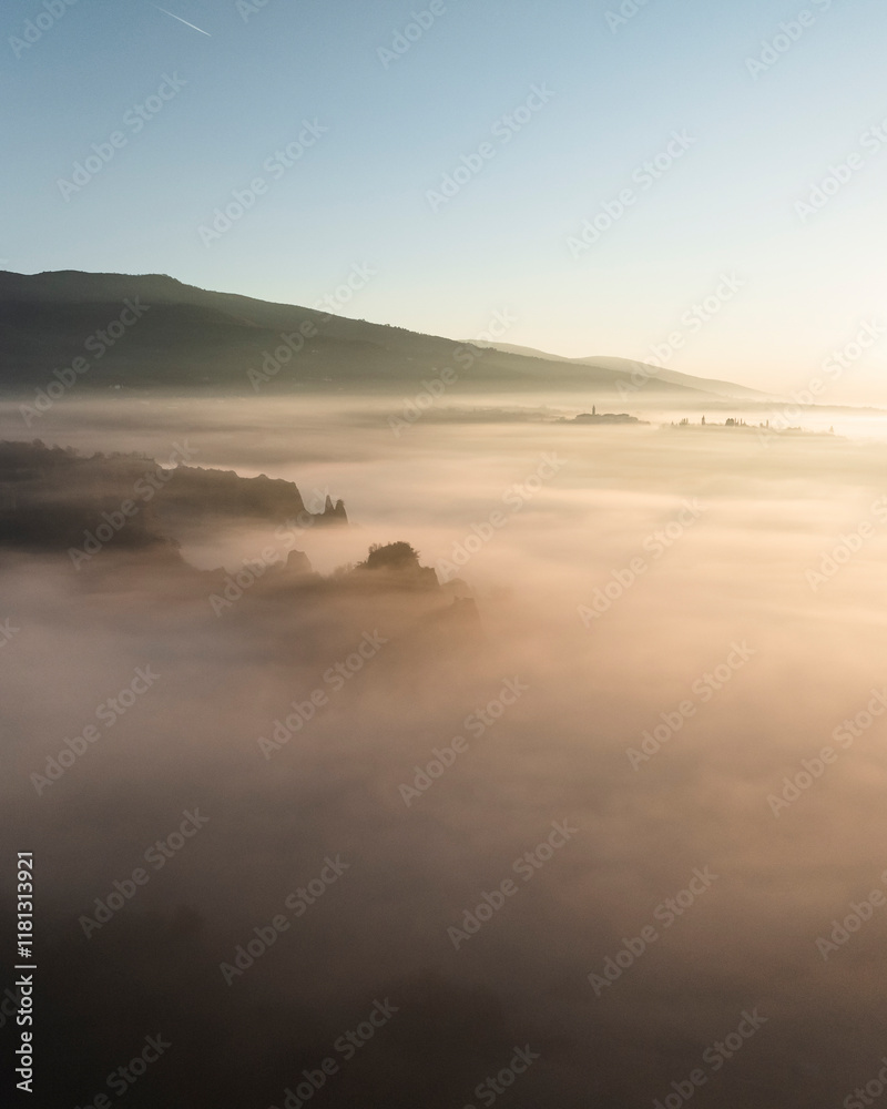 Aerial view of balze valdarno shrouded in fog and mist at sunrise, Tuscany, Reggello, Italy. Aerial view of balze valdarno shrouded in fog and mist at sunrise, Tuscany, Reggello, Italy.