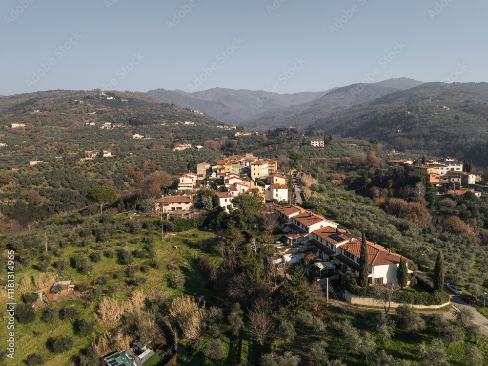 Aerial view of Canova village nestled in the serene hills with beautiful homes and trees, Tuscany, Reggello, Italy. Aerial view of Canova village nestled in the serene hills with beautiful homes and trees, Tuscany, Reggello, Italy.