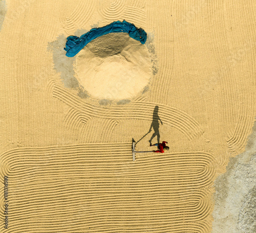 Aerial view of a unique pattern created by workers in sand under warm sunlight, Kastail, Bangladesh. photo