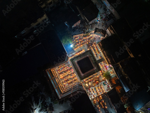 Aerial view of the vibrant kartik vrata festival with illuminated temple and gathering crowd, Gendaria, Bangladesh. photo