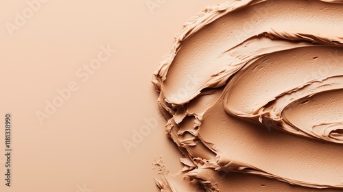 A smooth, creamy mocha mousse smear elegantly spread on a rich brown background, reflecting the trend color of 2025.