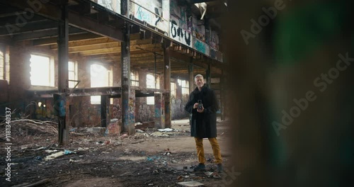 Wallpaper Mural Man standing in middle of abandoned factory ruin taking pictures Torontodigital.ca