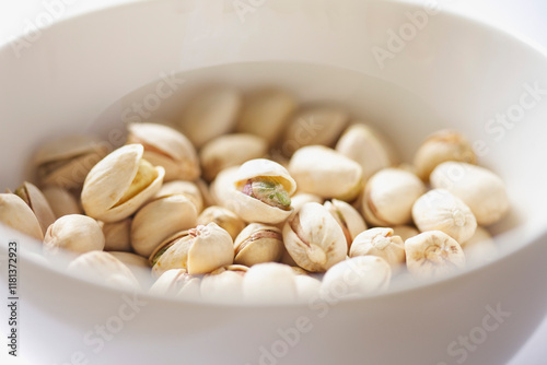 White Bowl Filled with Pistachios
 photo