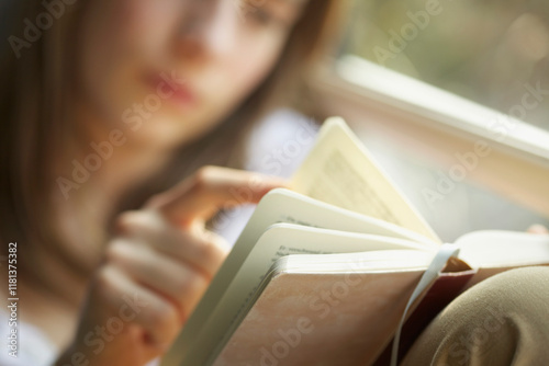 Teenage Girl Reading Book, Close-up view
 photo