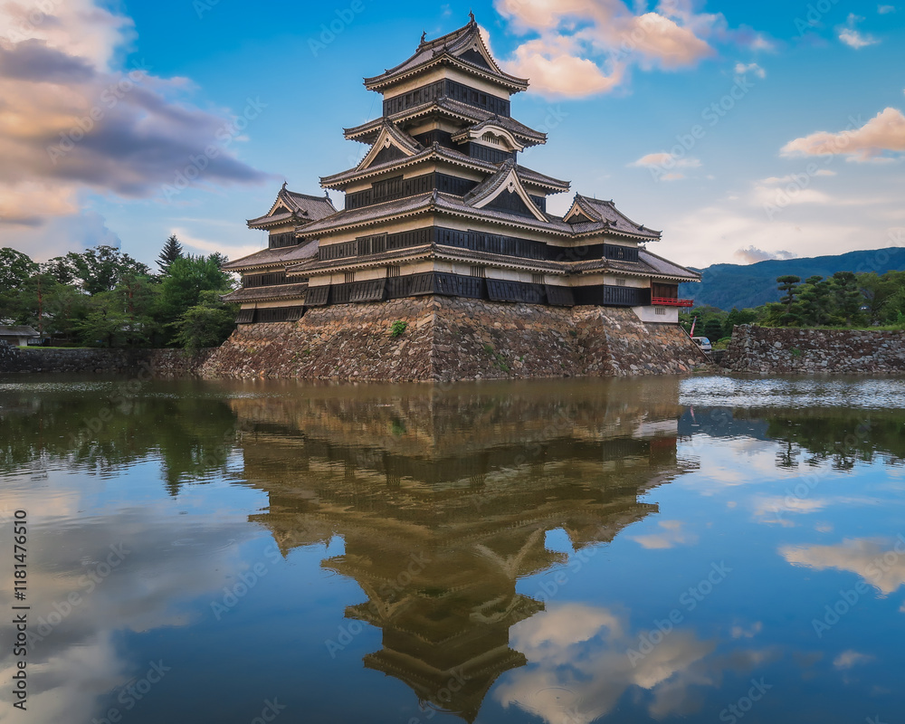 Matsumoto Castle and its reflection in the lake Matsumoto Castle and its reflection in the lake