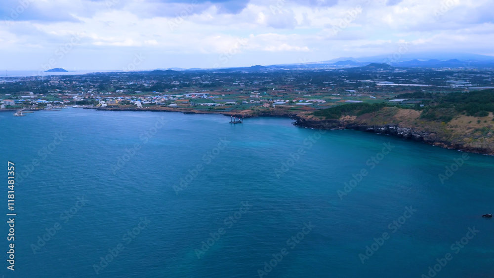 Fototapeta premium The beautiful island, Chagwido Island, and Wawa of Jeju Island in Korea are taken with drones from the sky, the sea, waves, and beautiful nature