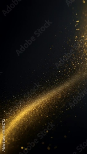 Abstract gold dust particles floating on black background.