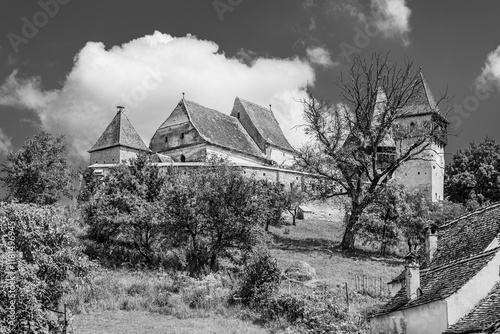 Alma Vii Saxon evanghelical fortified church, Sibiu county, Transylvania, Romania in black and white photo