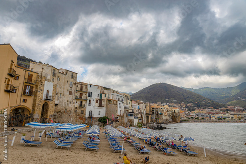 Fototapeta Naklejka Na Ścianę i Meble -  CEFALU', ITALY, JUNE 17, 2023 - The beach of Cefalù, province of Palermo, Sicily, Italy