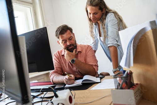 	
In their cozy newsroom, two dedicated co-worker journalists work tirelessly, driven by their shared passion for truth and storytelling.	
 photo