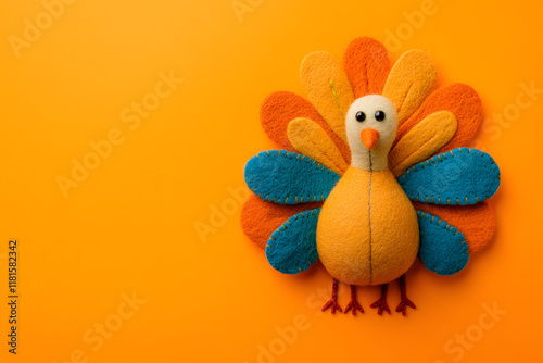 Photo of a cute felt turkey on an orange background. photo