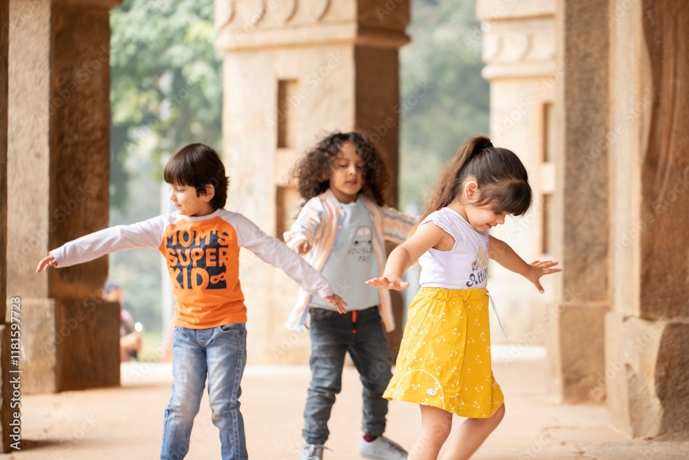 Nice Children Playing And Having Fun While Spreading Their Hands Apart Nice Children Playing And Having Fun While Spreading Their Hands Apart