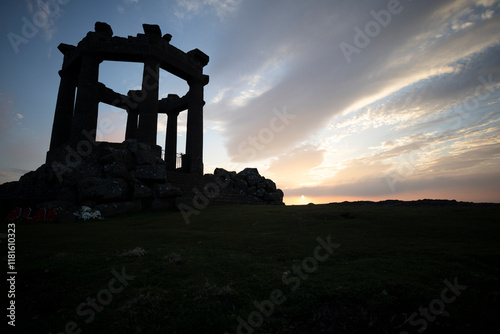 Sunset over the ruins of the war memorial in Stonehaven, Scotland, showcasing the remnants of historical architecture against a colorful sky photo