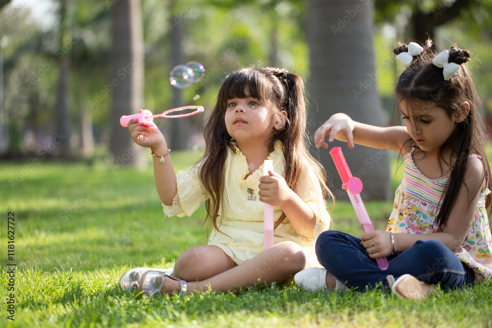 Happy Girls Holding Bubble Wand In The Hand Happy Girls Holding Bubble Wand In The Hand