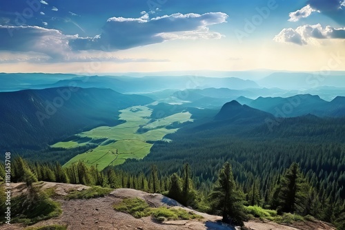 panorama from a mountain summit overlooking a vast landscape emp photo