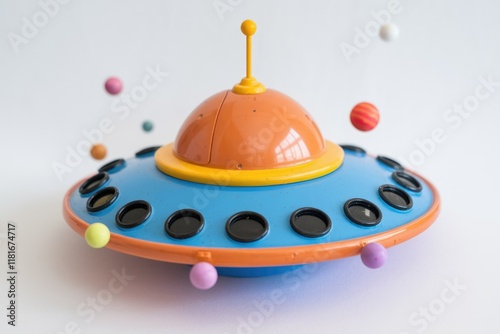 A colorful toy UFO surrounded by miniature planets, a playful depiction of space exploration. photo