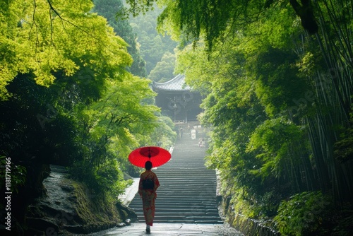 A Japanese woman in a kimono walks through a bamboo forest, holding a red umbrella. 