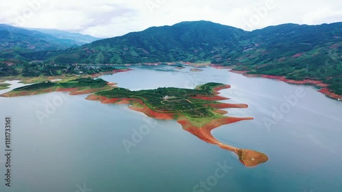 Sweeping views of rock sugar orange trees on mountains in Dehong, Yunnan during harvest season photo