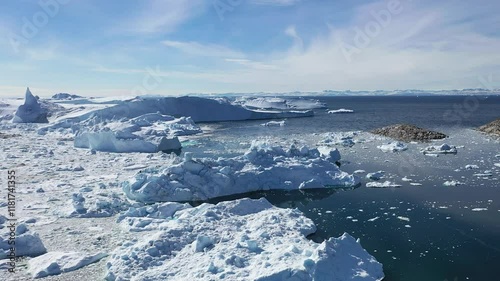 Wallpaper Mural Massive icebergs and tranquil waters reflect the beauty of a polar landscape in north Greenland during mid-afternoon Torontodigital.ca
