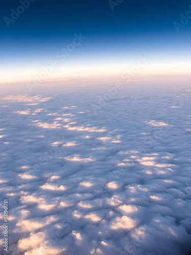 High-altitude view of polar mesospheric clouds, delicately lit by the midnight sun at extreme latitudes, floating serenely above the Earth photo