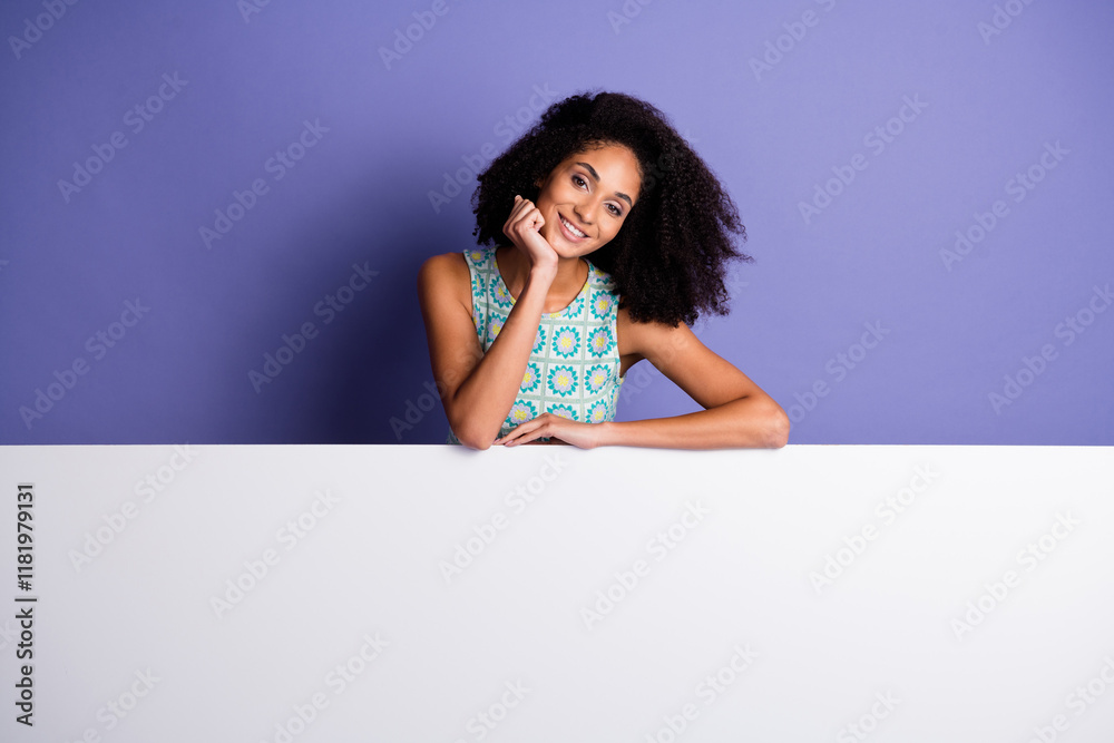 Charming young african american woman posing against a purple background wearing stylish summer top Charming young african american woman posing against a purple background wearing stylish summer top