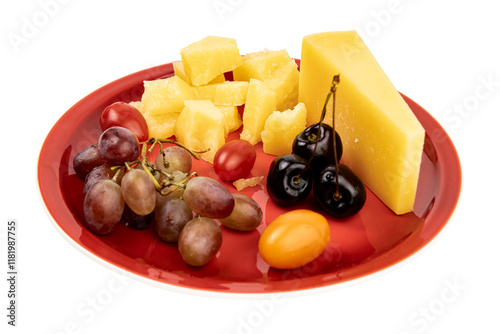 Assorted fruits and cheese arranged on a red plate for a fresh and healthy snack option during a summer gathering