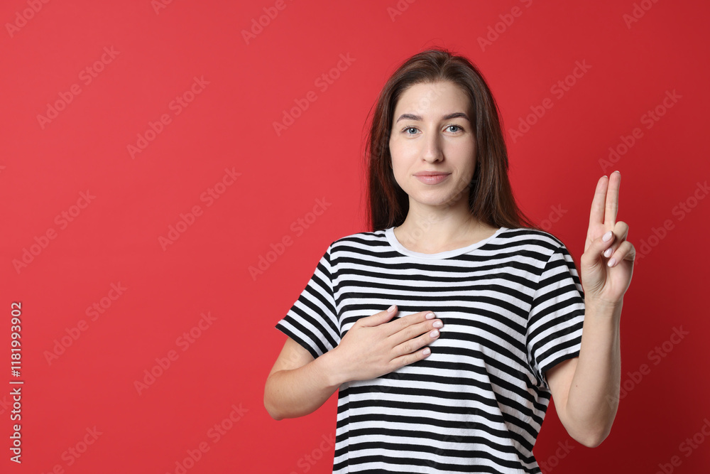 Woman showing oath gesture on red background, space for text. Making promise Woman showing oath gesture on red background, space for text. Making promise