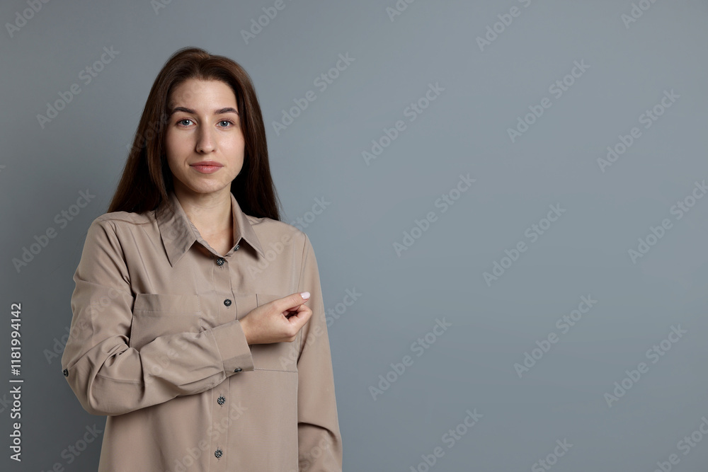 Woman making promise on grey background, space for text. Oath gesture Woman making promise on grey background, space for text. Oath gesture
