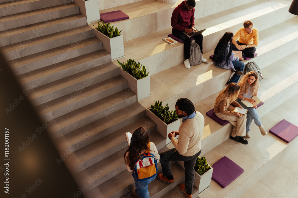 Φωτογραφία University students collaborating and studying in modern campus area