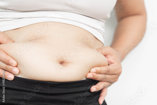 Closeup of abdominal surface woman fat, healthy care and beauty concept photo