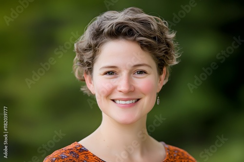 Cheerful Woman with Curly Hair Smiling in Outdoor Nature Setting