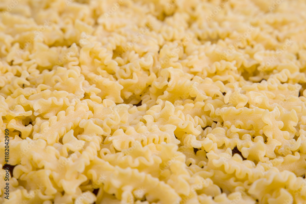 close up of italian pasta mafalda, selective focus close up of italian pasta mafalda, selective focus