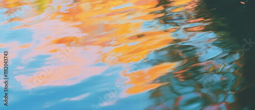Vibrant autumn colors reflecting in a tranquil lake surrounded by a serene forest