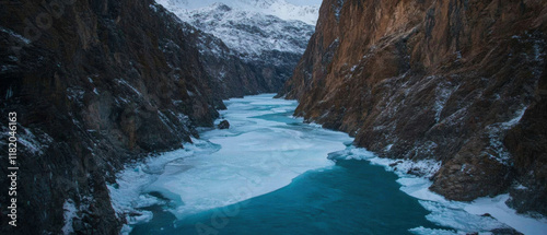 Dramatic U-shaped canyon carved by glaciers with steep walls and a glacial river photo