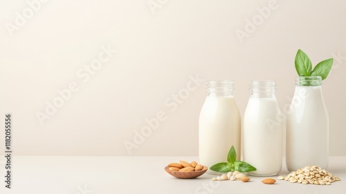 Healthy Living and Plant based nutritional. Bottles of milk with nuts and leaves on a light background. photo