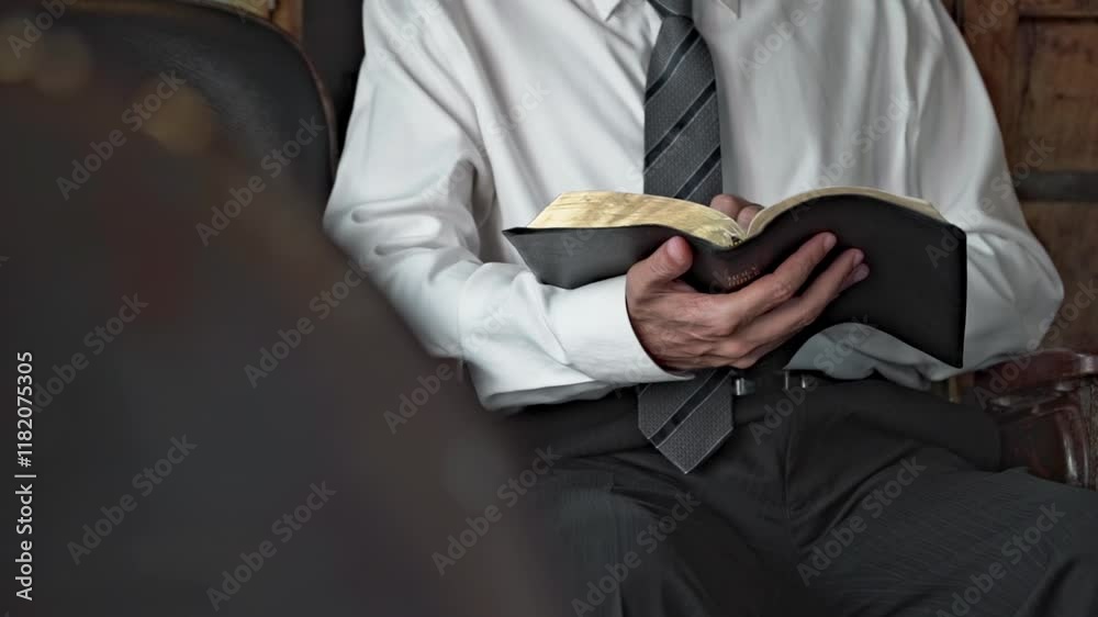 businessman open the book of the bible and read it indoors vintage retro style wall