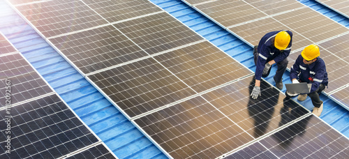 Professional inspecting solar panel installations on a rooftop ensuring renewable energy efficiency and sustainability practices highlighting clean energy technologies and environmental benefits. photo