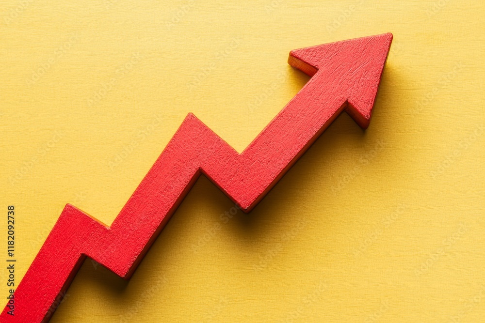 Economic growth depicted by a red upward arrow against a yellow background Economic growth depicted by a red upward arrow against a yellow background