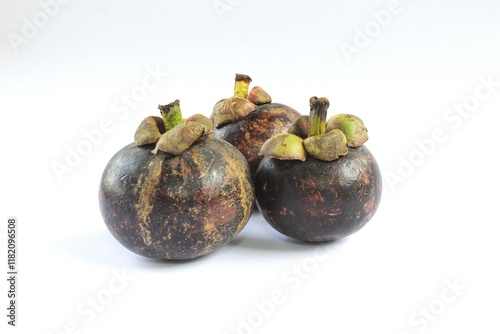 Mangosteen or Garcinia mangostana on a white background