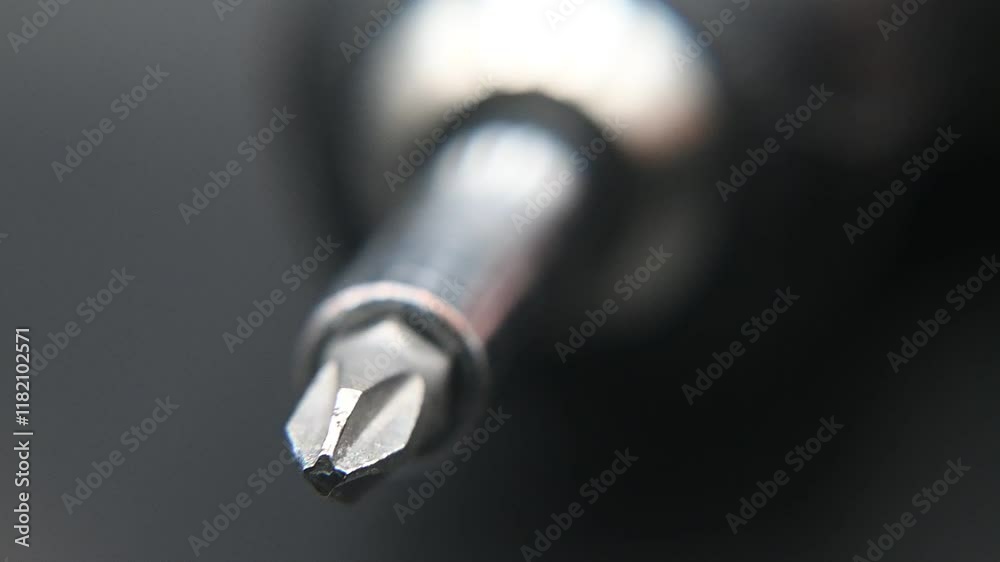 Spinning screwdriver bit, DIY at home.
