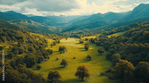 Majestic lush green valley with trees and colorful grass against high mountains in asturias in spain. beautiful view landscape with tree sky