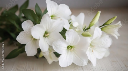 Elegant White Flowers on Wooden Surface with Natural Green Leaves Background