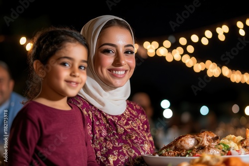 Family enjoying traditional iftar meal together during ramadan celebration. photo