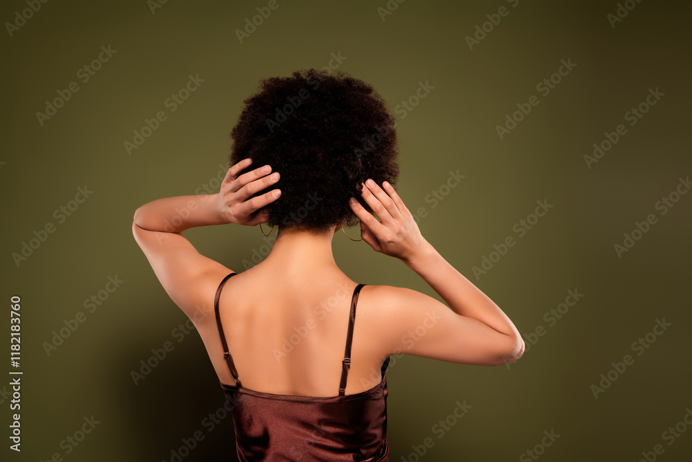Photo of gorgeous pretty charming lady curly hairstyle isolated on khaki color background Photo of gorgeous pretty charming lady curly hairstyle isolated on khaki color background