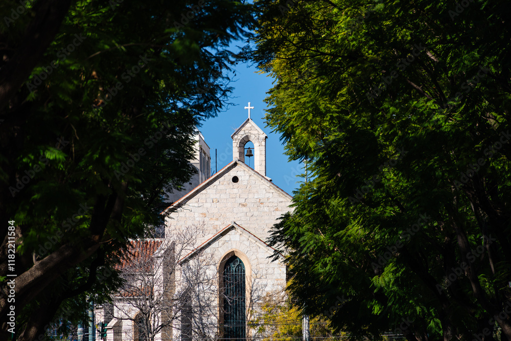 St. Paul's Anglican Church in Athens. Photo with this Anglican church through green trees next to National Garden from Athens, Greece.