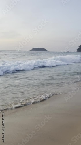 Beautiful sunset over calm ocean waves at a serene beach location photo